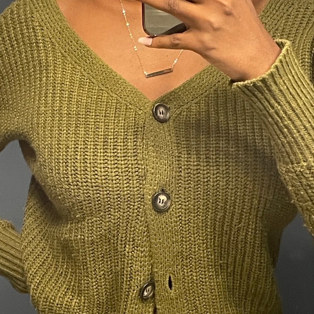 olive green button-up cardigan.